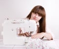 Beautiful girl sewing