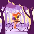 A beautiful girl in shorts rides a bike through the forest.
