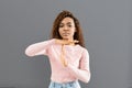 Beautiful girl showing time out sign over grey background Royalty Free Stock Photo