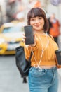 Beautiful girl shows blank screen smartphone Royalty Free Stock Photo