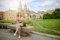 Beautiful girl during sightseeing old castle in Cracow, Wawel.