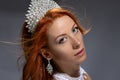 Beautiful girl in a silver with diamonds crown  on white Royalty Free Stock Photo