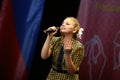 Beautiful girl sings on stage Royalty Free Stock Photo