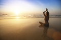 Beautiful girl sit at the seaside and meditating in yoga pose. Royalty Free Stock Photo