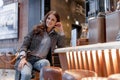 A beautiful girl is sitting at the bar and smiling at the camera Royalty Free Stock Photo