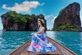 Beautiful girl sitting on the boat at James Bond island in Phang nga, Thailand. Royalty Free Stock Photo