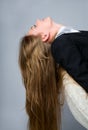 Beautiful girl is sitting in a chair Royalty Free Stock Photo