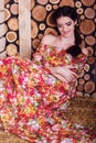 Beautiful girl is sitting on hay stack Royalty Free Stock Photo