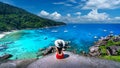 Beautiful girl sitting on the rock at Similan island, Thailand Royalty Free Stock Photo