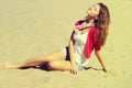 Beautiful girl sitting on the sand Royalty Free Stock Photo