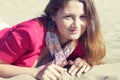 Beautiful girl sitting on the sand Royalty Free Stock Photo
