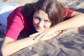 Beautiful girl sitting on the sand Royalty Free Stock Photo