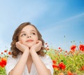 Beautiful girl sitting at table and looking up Royalty Free Stock Photo