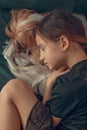 Beautiful girl sleeping with her dog. Best friends. Vertical shot. Lifestyle Royalty Free Stock Photo