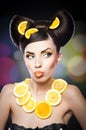 Beautiful girl with slices lemon as neck less