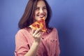 Beautiful girl with a slide of pizza Royalty Free Stock Photo