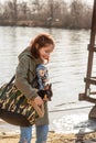 Beautiful girl with a small dog. girl on a walk with a dog and a doll. Girl playing doll. Portrait of a girl 9 years old Royalty Free Stock Photo