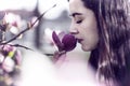 Beautiful girl smelling the flowers. Royalty Free Stock Photo