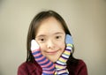 Beautiful girl smiling with different socks Royalty Free Stock Photo