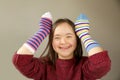 Beautiful girl smiling with different socks Royalty Free Stock Photo