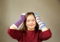 Beautiful girl smiling with different socks Royalty Free Stock Photo