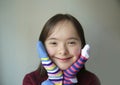 Beautiful girl smiling with socks. Royalty Free Stock Photo