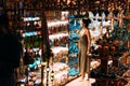 Beautiful girl in a souvenir shop in Morocco. Girl chooses a souvenir Oriental shop. Street shop. Moroccan Souvenirs. Oriental Royalty Free Stock Photo