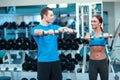 Beautiful girl in sports club with instructor Royalty Free Stock Photo