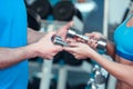 Beautiful girl in sports club with instructor Royalty Free Stock Photo