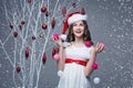 Beautiful girl standing near tree with christmas decorations Royalty Free Stock Photo