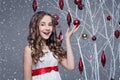 Beautiful girl standing near tree with christmas decorations Royalty Free Stock Photo