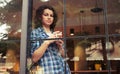 Beautiful girl standing near window Royalty Free Stock Photo