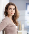 Beautiful girl standing at wall