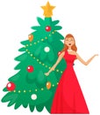 Beautiful girl stands near fir tree and sings festive song. New Year and Christmas. Winter holidays