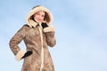 Beautiful girl stands in winter overcoat