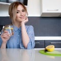Beautiful girl starts her morning with a glass of water with lemon Royalty Free Stock Photo