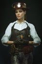 Beautiful girl steampunk. Posing with the clock Royalty Free Stock Photo