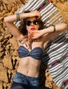Beautiful girl on a stony beach Royalty Free Stock Photo