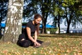 Beautiful girl studying yoga in the park Royalty Free Stock Photo