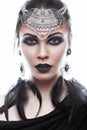 Beautiful girl in style of black queen. Image for a Halloween. Photos shot in the studio Royalty Free Stock Photo