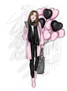 A beautiful girl in a stylish coat. Fashionable clothes and accessories, fashion and style. Heart shaped balloons. Valentine`s Day