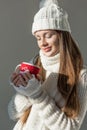 beautiful girl in stylish winter sweater and scarf holding cup of tea isolated Royalty Free Stock Photo