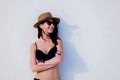 Beautiful girl in sunglasses, hat, black bikini Royalty Free Stock Photo
