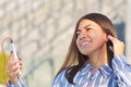 Beautiful girl on a Sunny spring day listening to music Royalty Free Stock Photo