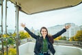 Beautiful girl taking picture at Ferris wheel on her phone Royalty Free Stock Photo