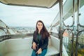 Beautiful girl taking picture at Ferris wheel on her phone Royalty Free Stock Photo