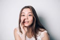 Beautiful girl telling a secret .Portrait young happy woman.Funny girl model whispering about something. Royalty Free Stock Photo