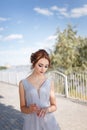 Beautiful girl in tender prom dress. Female portrait on spring landscape. Royalty Free Stock Photo