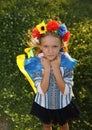 Beautiful girl in traditional Ukrainian clothes holding a flag of ukraine Royalty Free Stock Photo