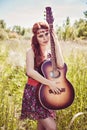 Beautiful girl travelling with her guitar in summer Royalty Free Stock Photo